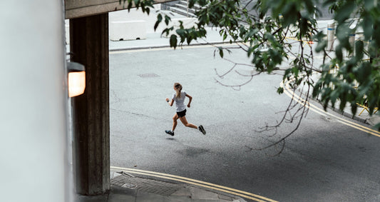 Woman looking happy running at night