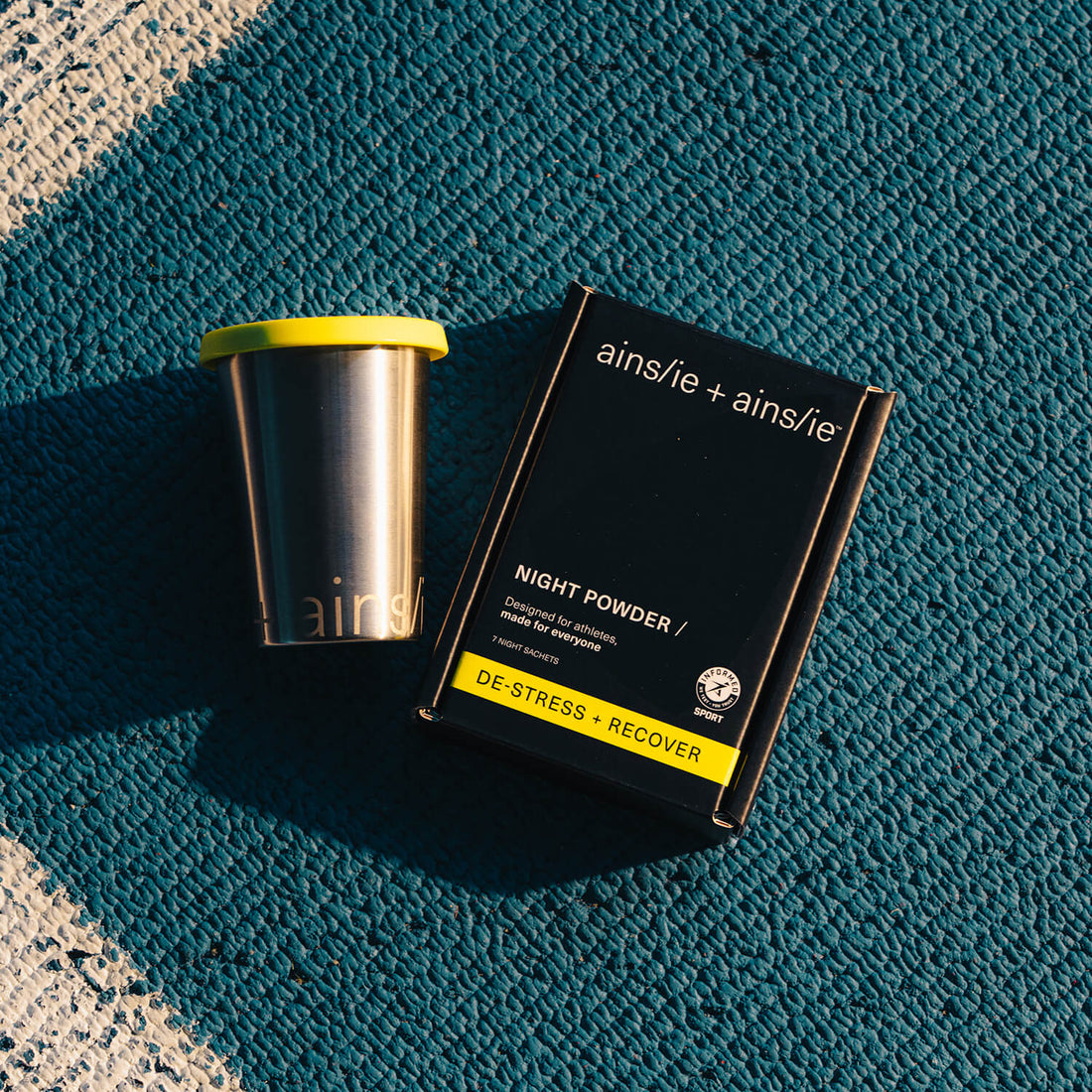 ainslie + ainslie NIGHT POWDER on an athletics track